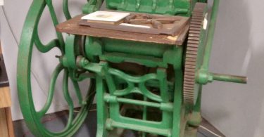 A printing press producing local newspapers
