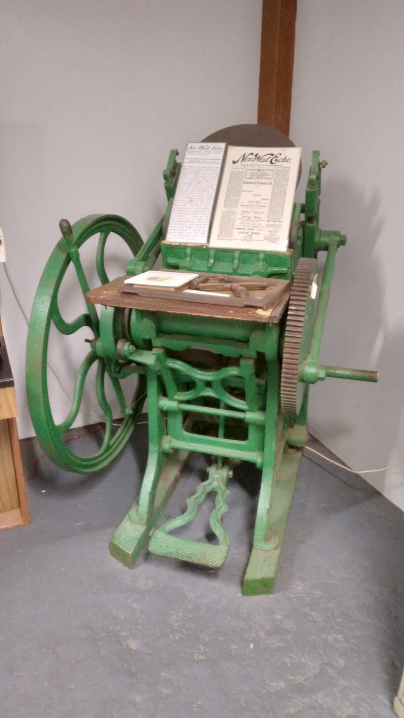 A printing press producing local newspapers