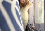 A person gazing out of a window